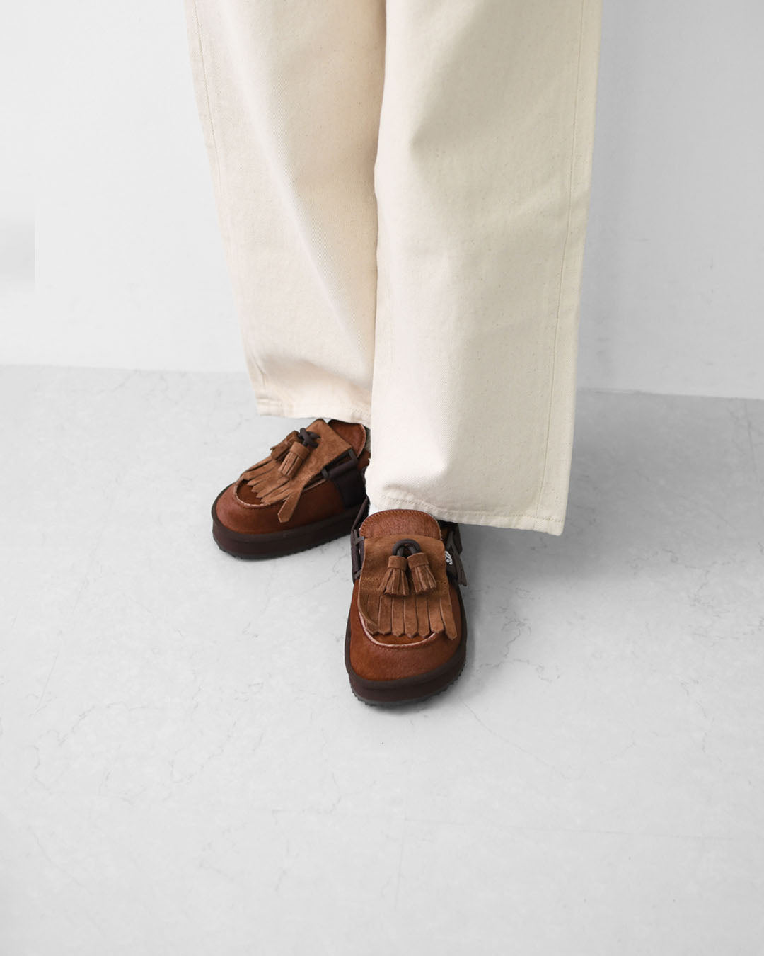 SHAKA [シャカ] MOC MULE TASSEL COWHAIR [SK-339] キルトタッセル付きミュールサンダル [2025AW]